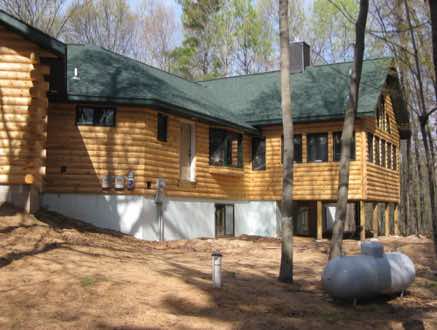 An awesome four season room on the back to take in the view of the woods