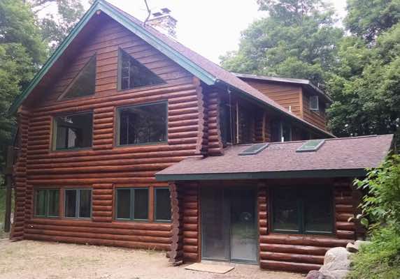 The porch is gone, the greatroom is extended and the basement addition is complete