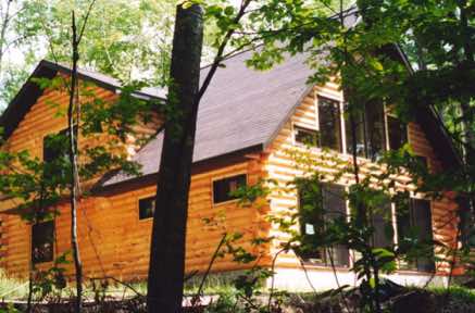 A log cabin built on a concrete slab in the Siren, WI/Webb Lake, WI area